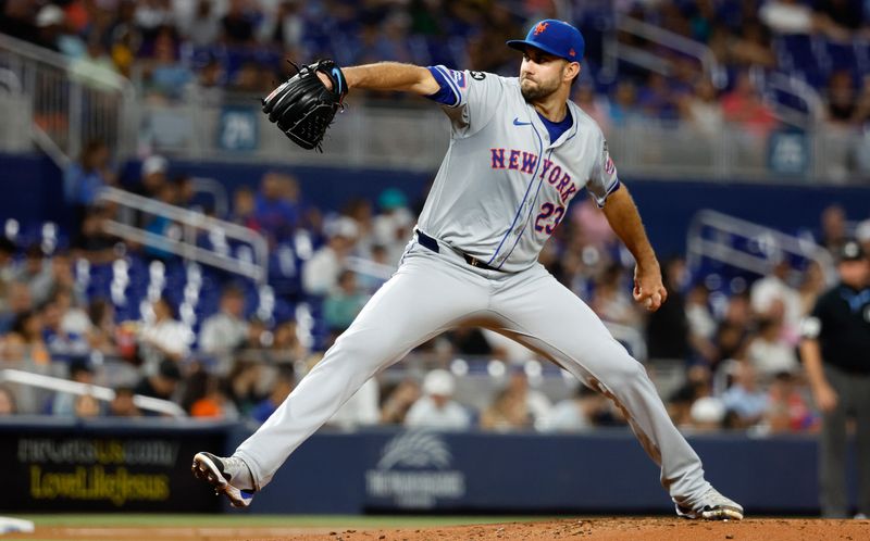 Jul 22, 2024; Miami, Florida, USA;  New York Mets starting pitcher David Peterson (23) pitches against the Miami Marlins in the second inning at loanDepot Park. Mandatory Credit: Rhona Wise-USA TODAY Sports