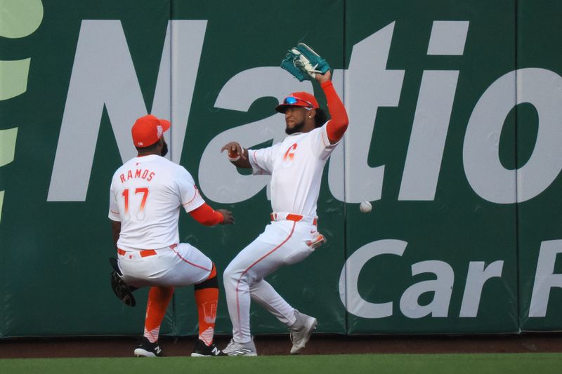 May 14, 2024; San Francisco, California, USA; San Francisco Giants left fielder Heliot Ramos (17) and center fielder Luis Matos (29) are unable to control the ball against the Los Angeles Dodgers during the first inning at Oracle Park. Mandatory Credit: Kelley L Cox-USA TODAY Sports