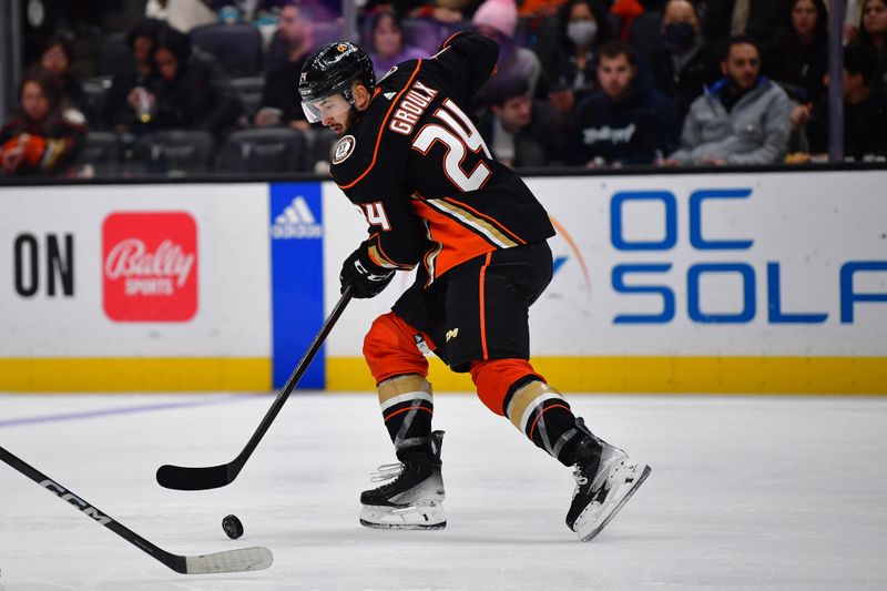 Jan 31, 2024; Anaheim, California, USA; Anaheim Ducks center Bo Groulx (24) moves the puck against the San Jose Sharks during the third period at Honda Center. Mandatory Credit: Gary A. Vasquez-USA TODAY Sports