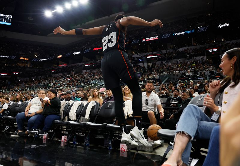 SAN ANTONIO, TX - APRIL 14:  Jaden Ivey #23 of the Detroit Pistons dives for a lose ball during game against the San Antonio Spurs in the second half at Frost Bank Center on April 14, 2024 in San Antonio, Texas. NOTE TO USER: User expressly acknowledges and agrees that, by downloading and or using this photograph, User is consenting to terms and conditions of the Getty Images License Agreement. (Photo by Ronald Cortes/Getty Images)