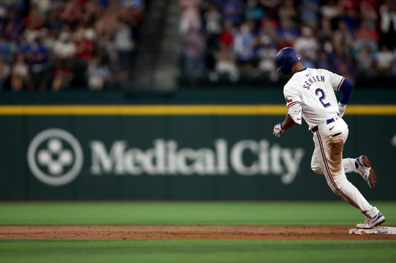 Jul 25, 2024; Arlington, Texas, USA; Texas Rangers second base Marcus Semien (2) rounds the bases after hitting a home run against the Chicago White Sox in the third inning at Globe Life Field. Mandatory Credit: Tim Heitman-USA TODAY Sports