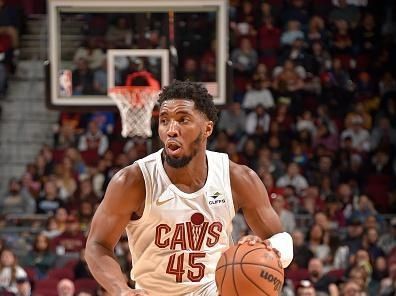 CLEVELAND, OH - NOVEMBER 26: Donovan Mitchell #45 of the Cleveland Cavaliers dribbles the ball during the game against the Toronto Raptors on November 26, 2023 at Rocket Mortgage FieldHouse in Cleveland, Ohio. NOTE TO USER: User expressly acknowledges and agrees that, by downloading and/or using this Photograph, user is consenting to the terms and conditions of the Getty Images License Agreement. Mandatory Copyright Notice: Copyright 2023 NBAE (Photo by David Liam Kyle/NBAE via Getty Images)