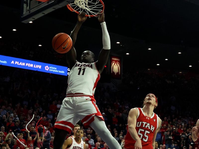 Jan 6, 2024; Tucson, Arizona, USA; Arizona Wildcats center Oumar Ballo (11) makes a basket against Utah Utes guard Gabe Madsen (55) during the second half at McKale Center. Mandatory Credit: Zachary BonDurant-USA TODAY Sports