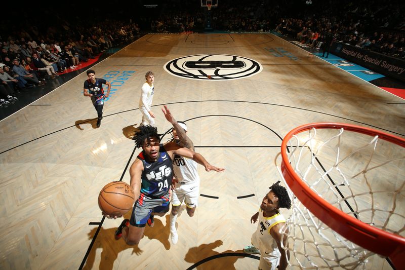 BROOKLYN, NY - JANUARY 29: Cam Thomas #24 of the Brooklyn Nets drives to the basket during the game against the Utah Jazz on January 29, 2024 at Barclays Center in Brooklyn, New York. NOTE TO USER: User expressly acknowledges and agrees that, by downloading and or using this Photograph, user is consenting to the terms and conditions of the Getty Images License Agreement. Mandatory Copyright Notice: Copyright 2024 NBAE (Photo by Nathaniel S. Butler/NBAE via Getty Images)