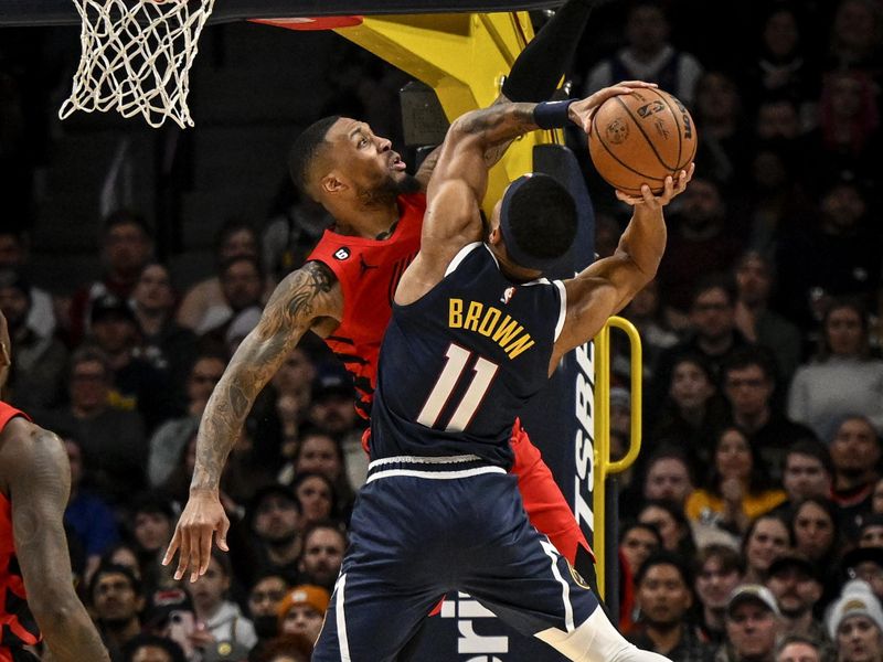 DENVER, CO - JANUARY 17: Damian Lillard (0) of the Portland Trail Blazers defends Bruce Brown (11) of the Denver Nuggets during the fourth quarter of Denvers 122-113 win at Ball Arena in Denver on Tuesday, January 17, 2023. (Photo by AAron Ontiveroz/MediaNews Group/The Denver Post via Getty Images)