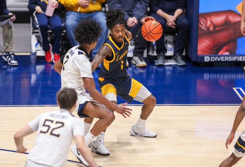 Dec 3, 2025; Morgantown, West Virginia, USA; Coppin State Eagles guard Hassan Perkins (1) dribbles against West Virginia Mountaineers guard Amir Jenkins (2) during the first half at Hope Coliseum. Mandatory Credit: Ben Queen-Imagn Images