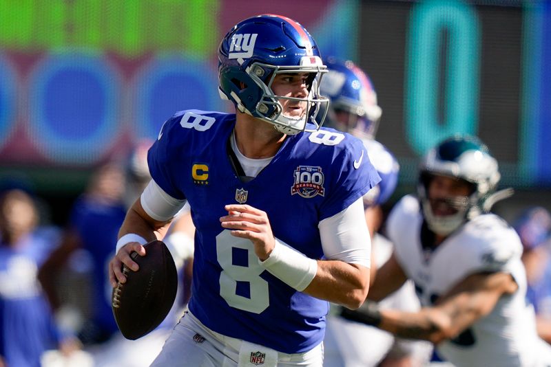 New York Giants quarterback Daniel Jones (8) steps back to pass against the Philadelphia Eagles during the first quarter of an NFL football game, Sunday, Oct. 20, 2024, in East Rutherford, N.J. (AP Photo/Frank Franklin II)