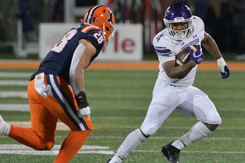 Nov 25, 2023; Champaign, Illinois, USA; Northwestern Wildcats running back Cam Porter (4) tries to elude the tackle of Illinois Fighting Illini linebacker Dylan Rosiek (28) during the second half at Memorial Stadium. Mandatory Credit: Ron Johnson-USA TODAY Sports