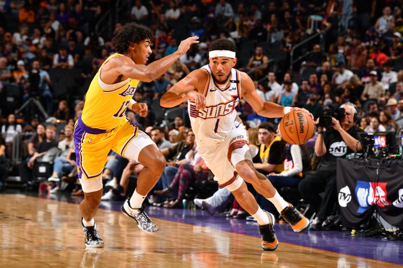 PHOENIX, AZ - OCTOBER 17: Devin Booker #1 of the Phoenix Suns drives to the basket during the game against the Los Angeles Lakers during a NBA Preseason game on October 17, 2024 at Footprint Center in Phoenix, Arizona. NOTE TO USER: User expressly acknowledges and agrees that, by downloading and or using this photograph, user is consenting to the terms and conditions of the Getty Images License Agreement. Mandatory Copyright Notice: Copyright 2024 NBAE (Photo by Barry Gossage/NBAE via Getty Images)