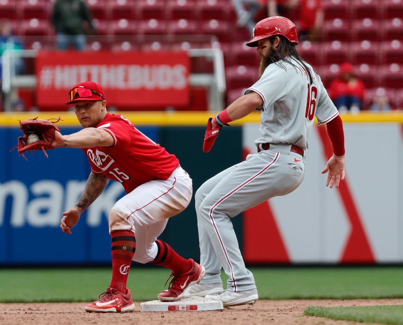 Apr 16, 2023; Cincinnati, Ohio, USA; Philadelphia Phillies center fielder Brandon Marsh (16) is safe at second against Cincinnati Reds second baseman Nick Senzel (15) during the ninth inning at Great American Ball Park. Mandatory Credit: David Kohl-USA TODAY Sports