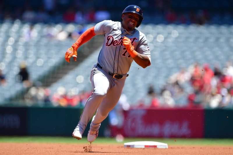 Jun 27, 2024; Anaheim, California, USA; Detroit Tigers second base Andy Ibáñez (77) reaches third on a triple against the Los Angeles Angels during the first inning at Angel Stadium. Mandatory Credit: Gary A. Vasquez-USA TODAY Sports