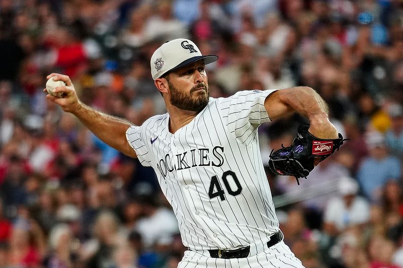 Jul 4, 2024; Denver, Colorado, USA; Colorado Rockies relief pitcher Tyler Kinley (40) delivers a pitch against the Milwaukee Brewers during the eighth inning at Coors Field. Mandatory Credit: Troy Babbitt-USA TODAY Sports

 