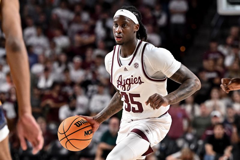 Nov 6, 2023; College Station, Texas, USA; Texas A&M Aggies guard Manny Obaseki (35) controls the ball during the second half against the Texas A&M Commerce at Reed Arena. Mandatory Credit: Maria Lysaker-USA TODAY Sports 