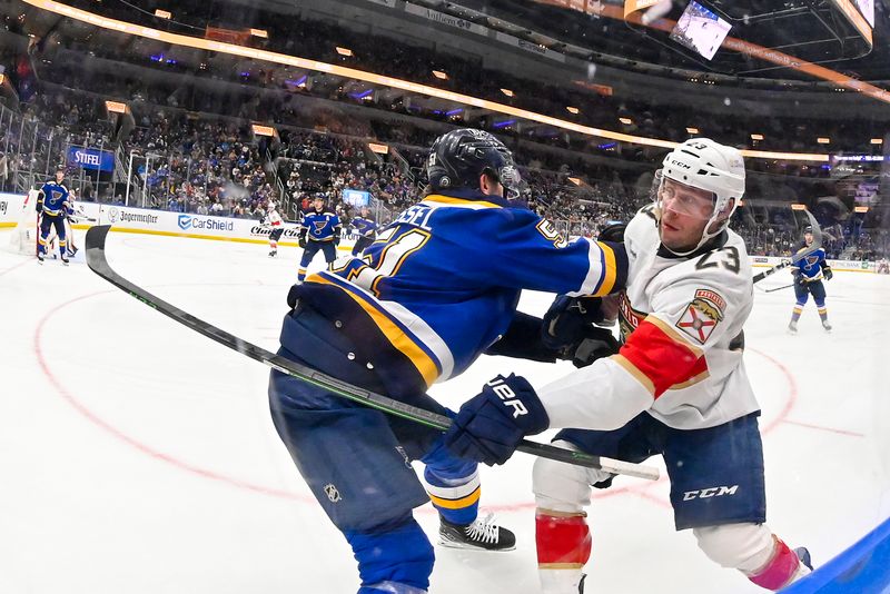 Jan 9, 2024; St. Louis, Missouri, USA;  St. Louis Blues defenseman Matthew Kessel (51) defends against Florida Panthers center Carter Verhaeghe (23) during the third period at Enterprise Center. Mandatory Credit: Jeff Curry-USA TODAY Sports