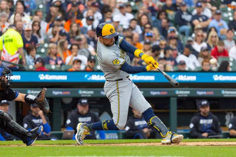 Jun 7, 2024; Detroit, Michigan, USA; Milwaukee Brewers first baseman Rhys Hoskins (12) singles during the second inning of the game against the Detroit Tigers at Comerica Park. Mandatory Credit: Brian Bradshaw Sevald-USA TODAY Sports