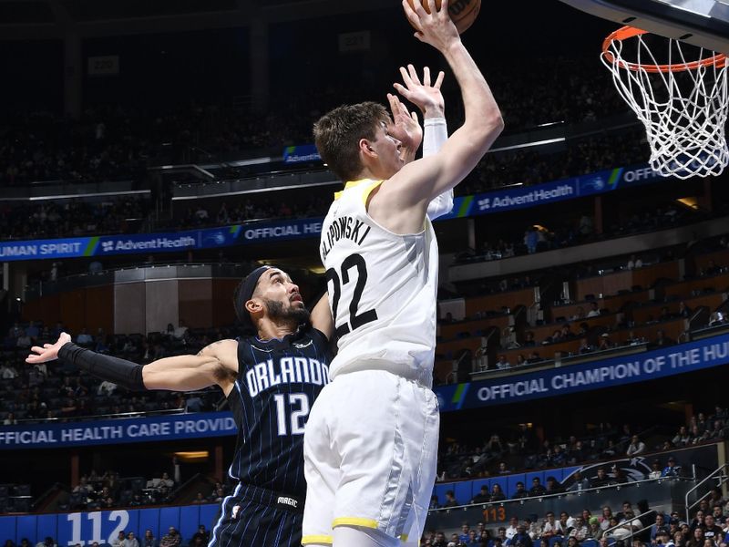 ORLANDO, FL - JANUARY 5 :  Kyle Filipowski #22 of the Utah Jazz drives to the basket during the game against the Orlando Magic on January 5, 2025 at Kia Center in Orlando, Florida. NOTE TO USER: User expressly acknowledges and agrees that, by downloading and or using this photograph, User is consenting to the terms and conditions of the Getty Images License Agreement. Mandatory Copyright Notice: Copyright 2025 NBAE (Photo by Gary Bassing/NBAE via Getty Images)