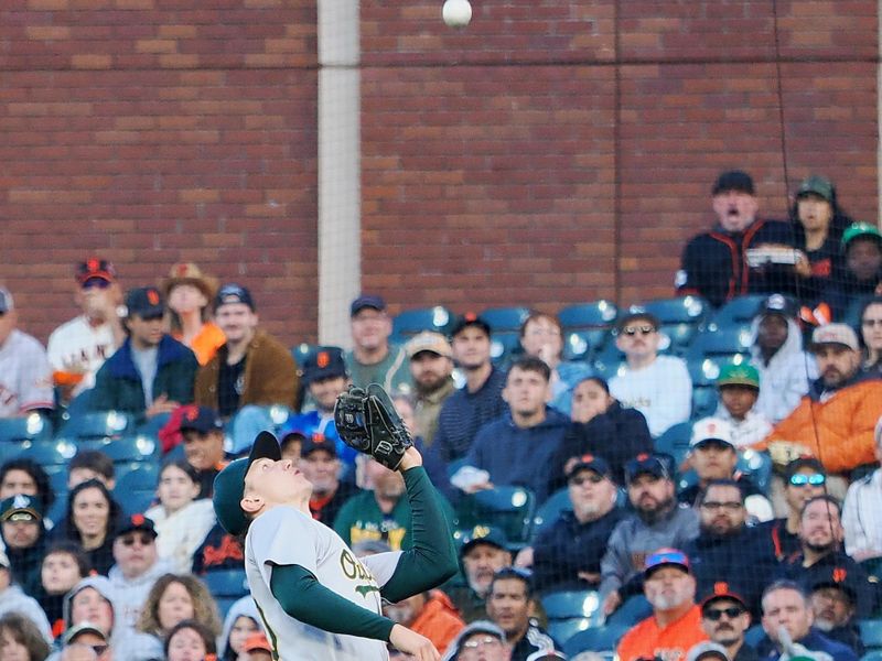 Jul 31, 2024; San Francisco, California, USA; Oakland Athletics second baseman Zack Gelof (20) catches the foul ball against the San Francisco Giants during the second inning at Oracle Park. Mandatory Credit: Kelley L Cox-USA TODAY Sports