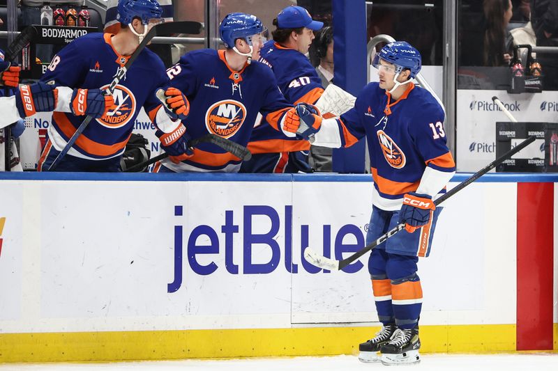 Oct 29, 2024; Elmont, New York, USA;  New York Islanders center Mathew Barzal (13) celebrates with teammates after scoring a goal in the third period against the Anaheim Ducks at UBS Arena. Mandatory Credit: Wendell Cruz-Imagn Images