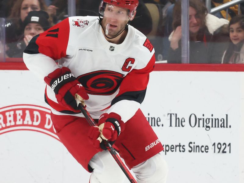 Dec 30, 2025; Pittsburgh, Pennsylvania, USA; Carolina Hurricanes center Jordan Staal (11) skates up ice with the puck against the Pittsburgh Penguins during the second period at PPG Paints Arena. Mandatory Credit: Charles LeClaire-Imagn Images