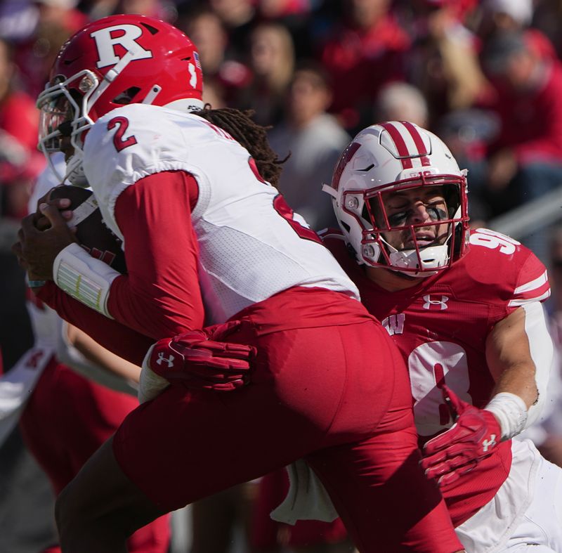 Oct 7, 2023; Madison, Wisconsin, USA; Wisconsin linebacker C.J. Goetz (98) tackles Rutgers quarterback Gavin Wimsatt (2) for no gain during the second quarter at Camp Randall Stadium. Mandatory Credit: Mark Hoffman-USA TODAY Sports