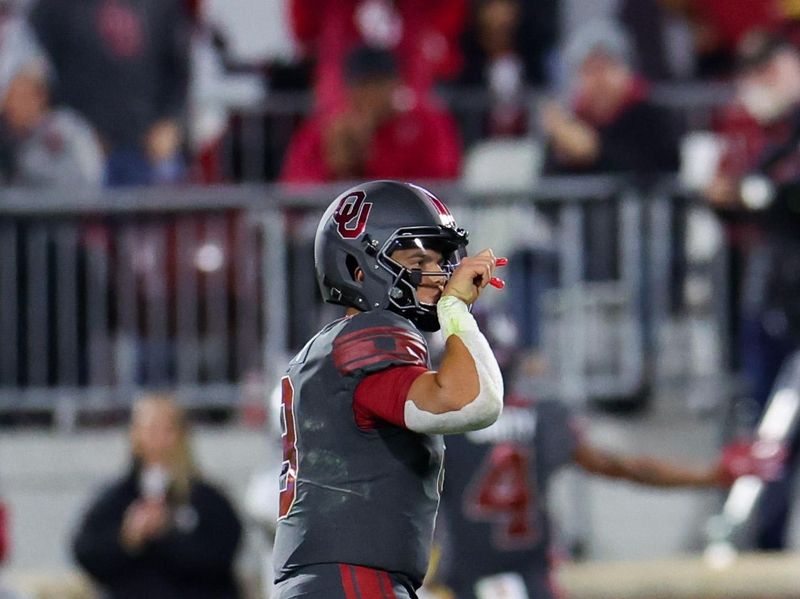 Nov 11, 2023; Norman, Oklahoma, USA; Oklahoma Sooners quarterback Dillon Gabriel (8) reacts after throwing a touchdown pass during the second quarter against the West Virginia Mountaineers at Gaylord Family-Oklahoma Memorial Stadium. Mandatory Credit: Kevin Jairaj-USA TODAY Sports