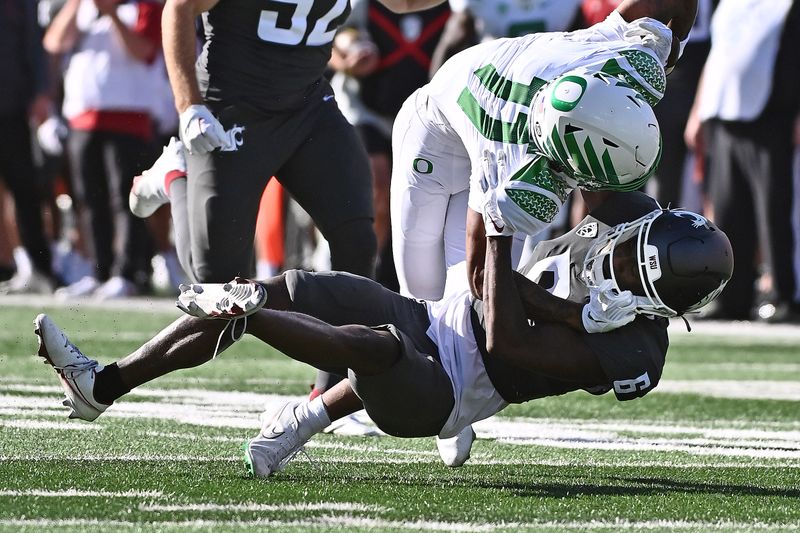 Sep 24, 2022; Pullman, Washington, USA; Oregon Ducks wide receiver Troy Franklin (11) is tackled by Washington State Cougars defensive back Chau Smith-Wade (6) in the second half at Gesa Field at Martin Stadium. Ducks won 44-41. Mandatory Credit: James Snook-USA TODAY Sports