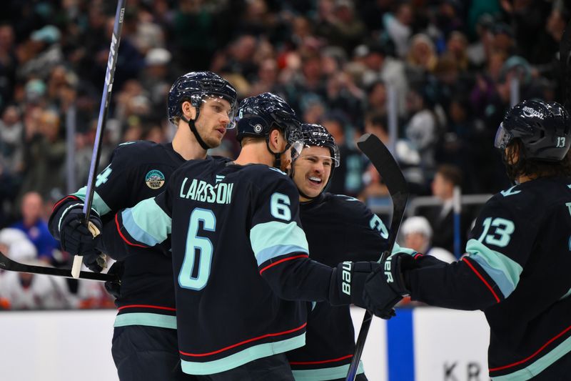 Nov 16, 2024; Seattle, Washington, USA; The Seattle Kraken celebrate after a goal scored by defenseman Jamie Oleksiak (24) during the third period against the New York Islanders at Climate Pledge Arena. Mandatory Credit: Steven Bisig-Imagn Images