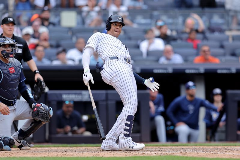 Jul 22, 2024; Bronx, New York, USA; New York Yankees right fielder Juan Soto (22) watches his solo home run against the Tampa Bay Rays during the seventh inning at Yankee Stadium. Mandatory Credit: Brad Penner-USA TODAY Sports