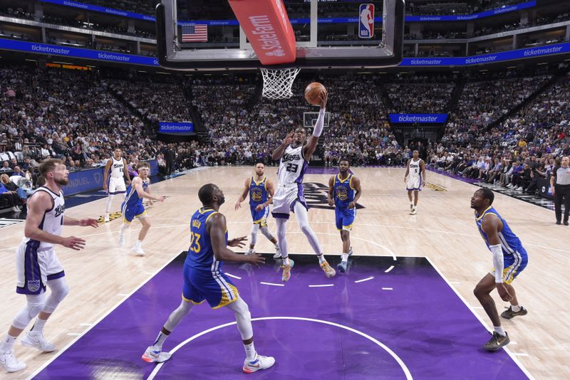 SACRAMENTO, CA - APRIL 16: Keon Ellis #23 of the Sacramento Kings drives to the basket during the game against the Golden State Warriors during the 2024 Play-In Tournament on April 16, 2024 at Golden 1 Center in Sacramento, California. NOTE TO USER: User expressly acknowledges and agrees that, by downloading and or using this Photograph, user is consenting to the terms and conditions of the Getty Images License Agreement. Mandatory Copyright Notice: Copyright 2024 NBAE (Photo by Rocky Widner/NBAE via Getty Images)