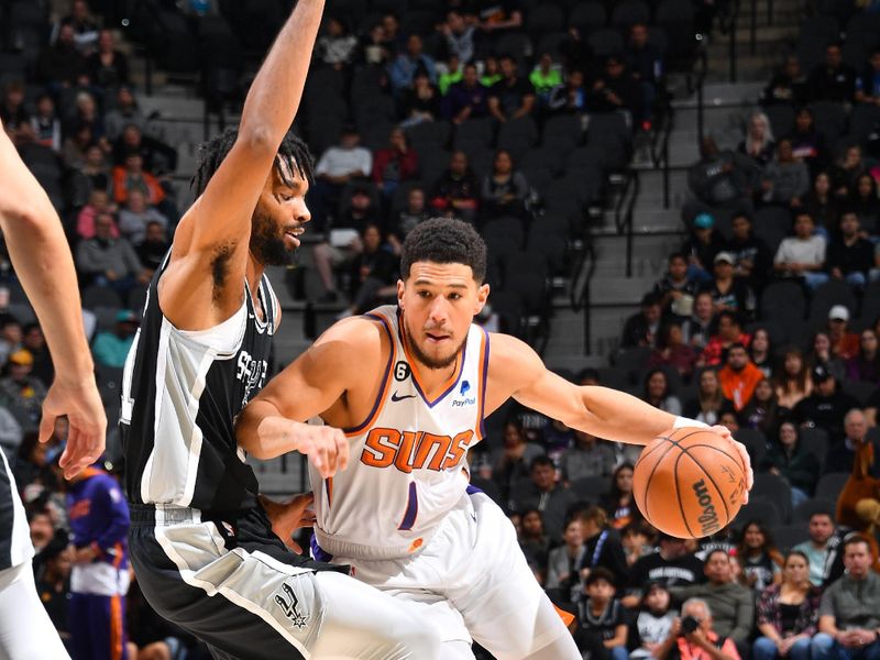 SAN ANTONIO, TX - DECEMBER 4: Devin Booker #1 of the Phoenix Suns dribbles the ball during the game against the San Antonio Spurs on December 4, 2022 at the AT&T Center in San Antonio, Texas. NOTE TO USER: User expressly acknowledges and agrees that, by downloading and or using this photograph, user is consenting to the terms and conditions of the Getty Images License Agreement. Mandatory Copyright Notice: Copyright 2022 NBAE (Photos by Michael Gonzales/NBAE via Getty Images)