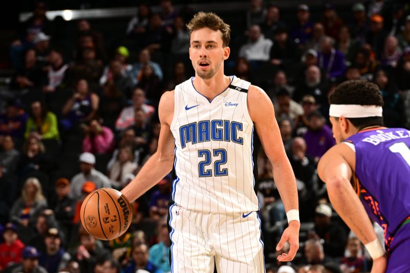 PHOENIX, AZ - NOVEMBER 18: Franz Wagner #22 of the Orlando Magic looks on during the game against the Phoenix Suns on November 18, 2024 at Footprint Center in Phoenix, Arizona. NOTE TO USER: User expressly acknowledges and agrees that, by downloading and or using this photograph, user is consenting to the terms and conditions of the Getty Images License Agreement. Mandatory Copyright Notice: Copyright 2024 NBAE (Photo by Kate Frese/NBAE via Getty Images)