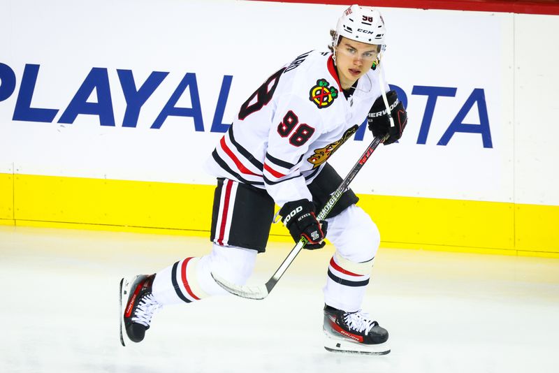 Oct 15, 2024; Calgary, Alberta, CAN; Chicago Blackhawks center Connor Bedard (98) skates during the warmup period against the Calgary Flames at Scotiabank Saddledome. Mandatory Credit: Sergei Belski-Imagn Images