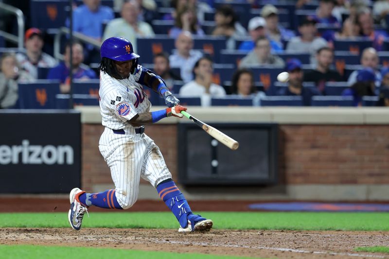 Sep 18, 2024; New York City, New York, USA; New York Mets shortstop Luisangel Acuna (2) hits a solo home run against the Washington Nationals during the eighth inning at Citi Field. Mandatory Credit: Brad Penner-Imagn Images