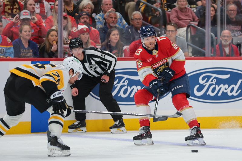 Oct 23, 2025; Sunrise, Florida, USA; Florida Panthers center Sam Reinhart (13) moves the puck against the Pittsburgh Penguins during the second period at Amerant Bank Arena. Mandatory Credit: Sam Navarro-Imagn Images