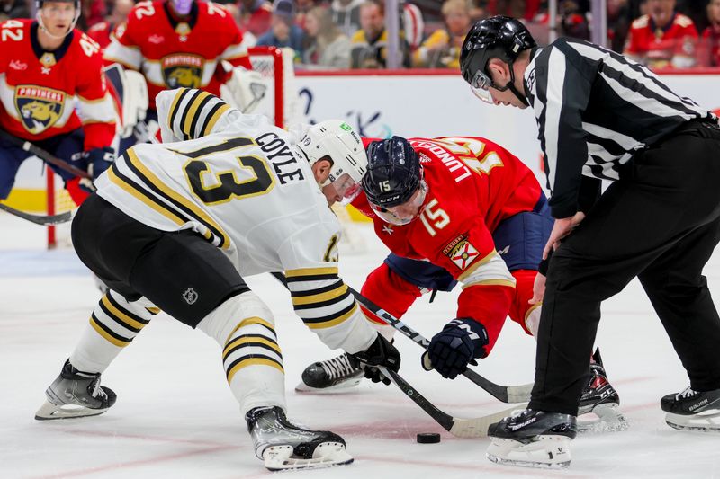 Nov 22, 2023; Sunrise, Florida, USA; Florida Panthers center Anton Lundell (15) and Boston Bruins center Charlie Coyle (13) face-off during the first period at Amerant Bank Arena. Mandatory Credit: Sam Navarro-USA TODAY Sports