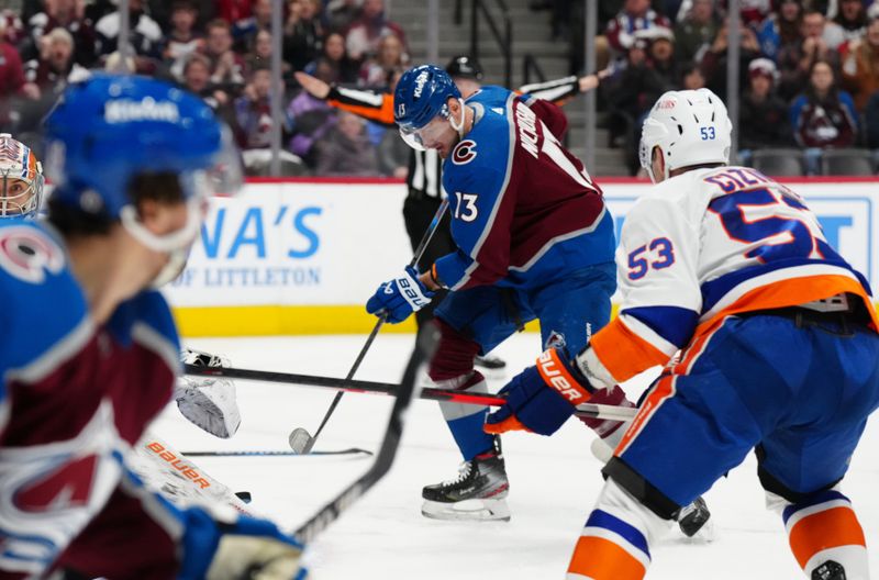 Jan 2, 2024; Denver, Colorado, USA; Colorado Avalanche right wing Valeri Nichushkin (13) shoots the puck in the second period against the New York Islanders at Ball Arena. Mandatory Credit: Ron Chenoy-USA TODAY Sports