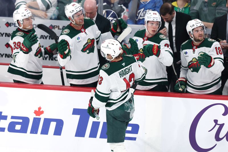 Sep 21, 2025; Winnipeg, Manitoba, CAN; Minnesota Wild center Hunter Haight (43) celebrates his goal against the Winnipeg Jets during the third period at Canada Life Centre. Mandatory Credit: James Carey Lauder-Imagn Images