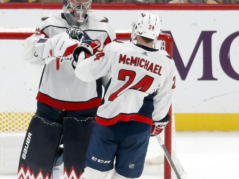 Mar 7, 2024; Pittsburgh, Pennsylvania, USA; Washington Capitals goaltender Charlie Lindgren (79) and center Connor McMichael (24) celebrate after defeating the Pittsburgh Penguins at PPG Paints Arena. The Capitals shutout the Penguins 6-0. Mandatory Credit: Charles LeClaire-USA TODAY Sports