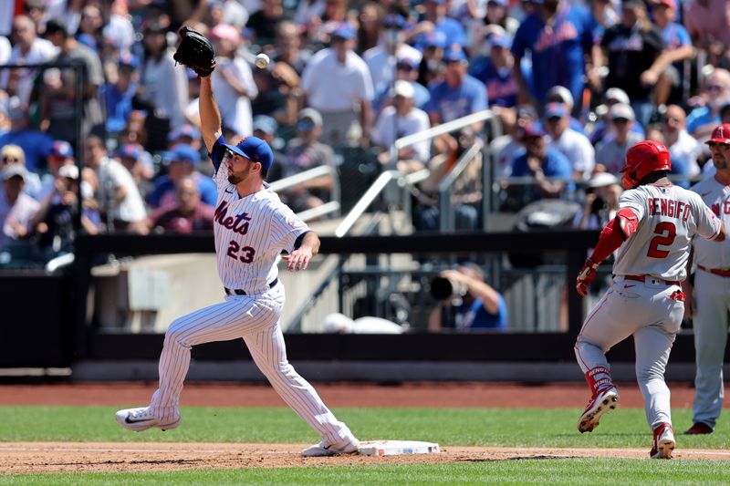 Aug 27, 2023; New York City, New York, USA; New York Mets starting pitcher David Peterson (23) can't catch a throw by first baseman Pete Alonso (not pictured) on a ground ball by Los Angeles Angels second baseman Luis Rengifo (2) during the third inning at Citi Field. Mandatory Credit: Brad Penner-USA TODAY Sports