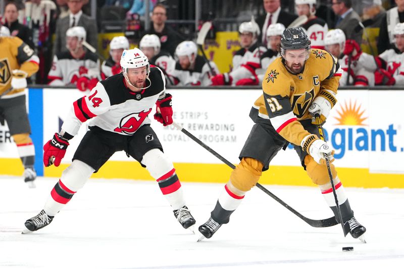Dec 17, 2025; Las Vegas, Nevada, USA; Vegas Golden Knights right wing Mark Stone (61) controls the puck ahead of New Jersey Devils center Luke Glendening (14) during the first period at T-Mobile Arena. Mandatory Credit: Stephen R. Sylvanie-Imagn Images