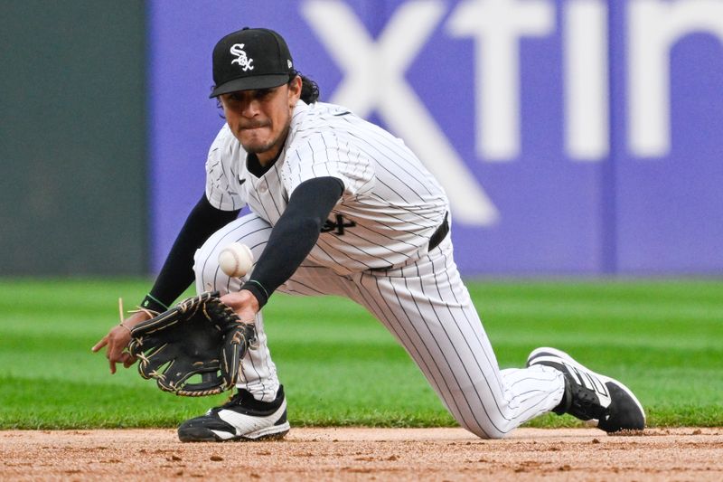 Jun 7, 2024; Chicago, Illinois, USA;  Chicago White Sox second base Nicky Lopez (8) catches a ball hit by Boston Red Sox outfielder Rob Refsnyder (30) during the first inning at Guaranteed Rate Field. Mandatory Credit: Matt Marton-USA TODAY Sports