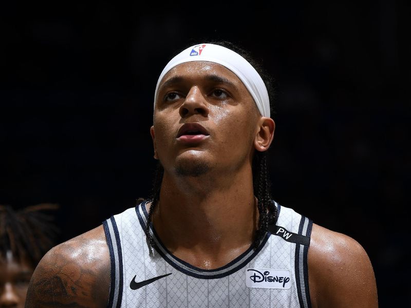 ORLANDO, FL - MARCH 2: Paolo Banchero #5 of the Orlando Magic shoots a free throw during the game against the Toronto Raptors on March 2, 2025 at Kia Center in Orlando, Florida. NOTE TO USER: User expressly acknowledges and agrees that, by downloading and or using this photograph, User is consenting to the terms and conditions of the Getty Images License Agreement. Mandatory Copyright Notice: Copyright 2025 NBAE (Photo by Fernando Medina/NBAE via Getty Images)