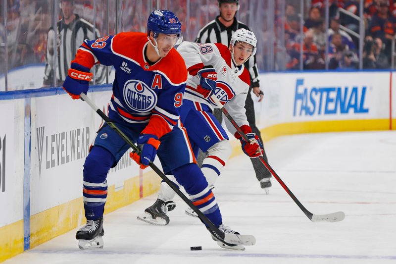Oct 23, 2025; Edmonton, Alberta, CAN; Edmonton Oilers forward Ryan Nugent-Hopkins (93) looks to make a pass in front of Montreal Canadiens defensemen Lane Hutton (48)/ during the second period at Rogers Place. Mandatory Credit: Perry Nelson-Imagn Images