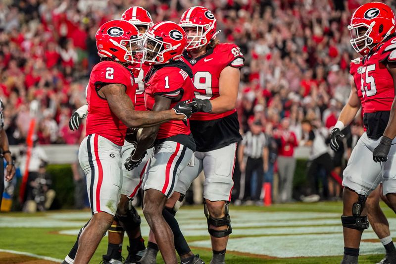 Oct 7, 2023; Athens, Georgia, USA; Georgia Bulldogs running back Kendall Milton (2) reacts with teammates after running for a touchdown past Kentucky Wildcats defensive back Zion Childress (11) during the first half at Sanford Stadium. Mandatory Credit: Dale Zanine-USA TODAY Sports