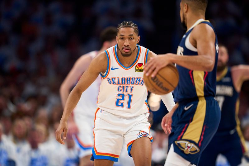 OKLAHOMA CITY, OKLAHOMA - APRIL 21: Aaron Wiggins #21 of the Oklahoma City Thunder defends against the New Orleans Pelicans in game one of the Western Conference First Round Playoffs at the Paycom Center on April 21, 2024 in Oklahoma City, Oklahoma. NOTE TO USER: User expressly acknowledges and agrees that, by downloading and or using this photograph, User is consenting to the terms and conditions of the Getty Images License Agreement.  (Photo by Cooper Neill/Getty Images)