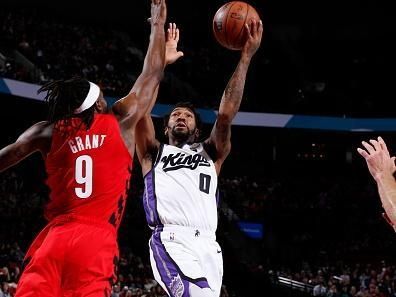 PORTLAND, OR - DECEMBER 26: Malik Monk #0 of the Sacramento Kings drives to the basket during the game against the Portland Trail Blazers on December 26, 2023 at the Moda Center Arena in Portland, Oregon. NOTE TO USER: User expressly acknowledges and agrees that, by downloading and or using this photograph, user is consenting to the terms and conditions of the Getty Images License Agreement. Mandatory Copyright Notice: Copyright 2023 NBAE (Photo by Cameron Browne/NBAE via Getty Images)