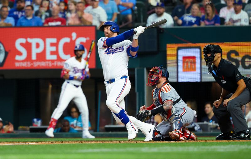Aug 17, 2024; Arlington, Texas, USA;  Texas Rangers designated hitter Carson Kelly (18) hits an rbi single during the second inning against the Minnesota Twins at Globe Life Field. Mandatory Credit: Kevin Jairaj-USA TODAY Sports