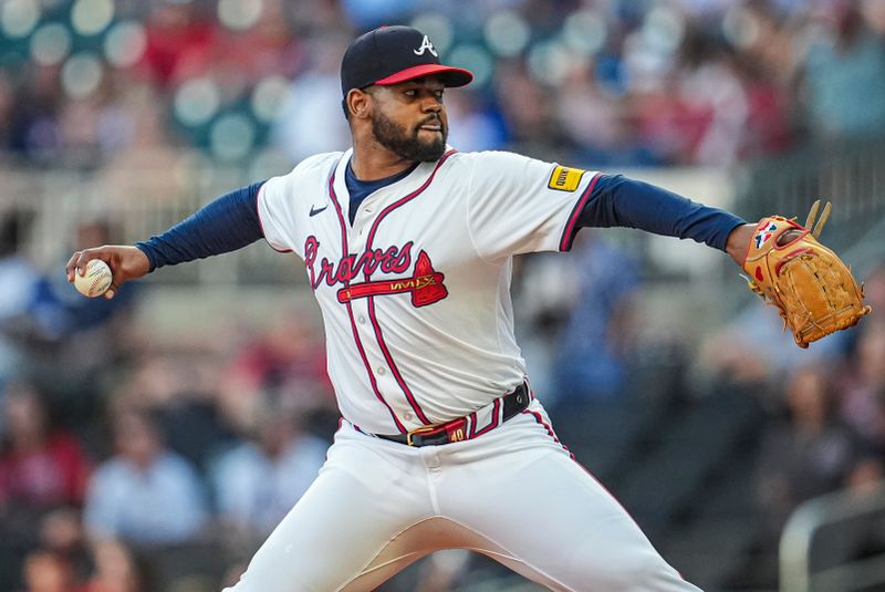 Aug 20, 2024; Cumberland, Georgia, USA; Atlanta Braves starting pitcher Reynaldo Lopez (40) pitches against the Philadelphia Phillies during the first inning at Truist Park. Mandatory Credit: Dale Zanine-USA TODAY Sports