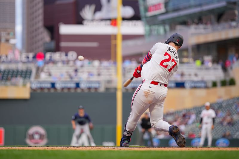 May 7, 2024; Minneapolis, Minnesota, USA; Minnesota Twins catcher Ryan Jeffers (27) hits a three-run home run against the Seattle Mariners in the third inning at Target Field. Mandatory Credit: Brad Rempel-USA TODAY Sports