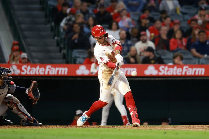 May 15, 2024; Anaheim, California, USA;  Los Angeles Angels shortstop Zach Neto (9) hits a solo home run during the sixth inning against the St. Louis Cardinals at Angel Stadium. Mandatory Credit: Kiyoshi Mio-USA TODAY Sports